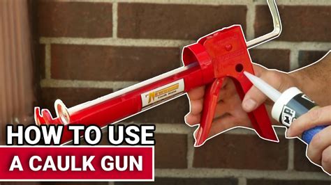 Here's how to use a caulking gun. Press the release at the rear of the gun with your thumb, releasing the plunger at the back of the gun. Pull the plunger all the way back. Put the tube into the gun, with the nozzle in the front. Push the plunger tightly into the back of the tube, and remove your thumb. The gun is now loaded. 